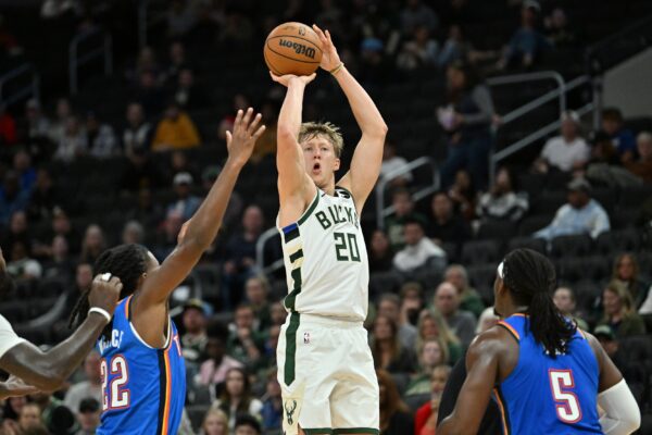 Milwaukee Bucks guard AJ Green (20) hits a three point shot against the Oklahoma City Thunder during the first half at Fiserv Forum.