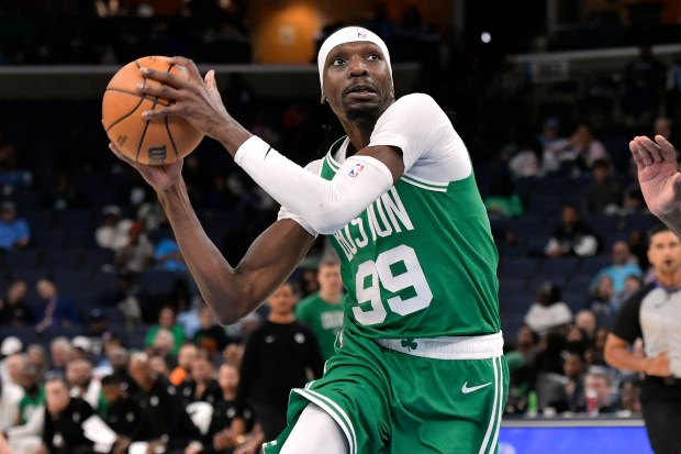 Boston Celtics forward Chris Boucher looks to shoot in the second half of an NBA basketball preseason game against the Memphis Grizzlies, Wednesday, Oct. 8, 2025, in Memphis, Tenn. (AP Photo/Brandon Dill)
