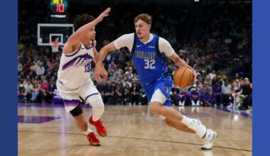 Dallas Mavericks forward Cooper Flagg (32) drives against Utah Jazz guard Walter Clayton Jr. (13) during the first half of a preseason NBA basketball game Monday, Oct. 13, 2025, in Salt Lake City. (AP Photo/Rob Gray)