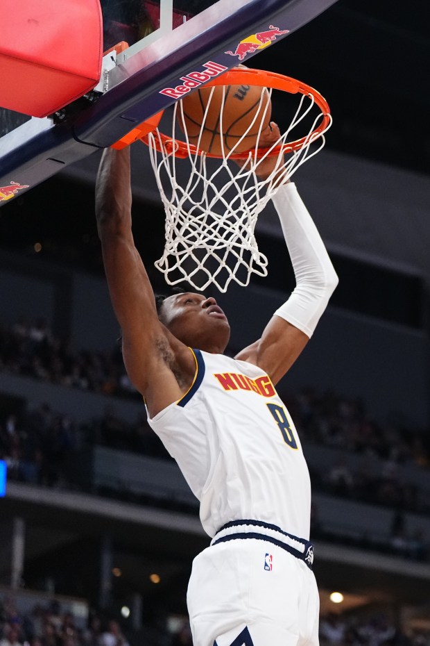 Denver Nuggets guard Peyton Watson dunks against the Chicago Bulls during the first half of a preseason NBA basketball game Tuesday, Oct. 14, 2025, in Denver. (AP Photo/Jack Dempsey)