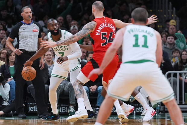 Boston Celtics forward Jaylen Brown (7) looks to pass during the first half of a preseason NBA basketball game, Wednesday, Oct. 15, 2025, in Boston. (AP Photo/Charles Krupa)