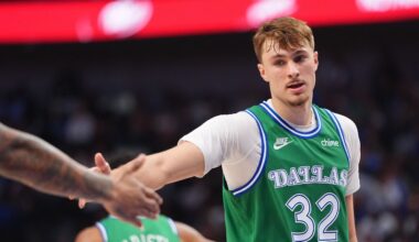 Dallas Mavericks forward Cooper Flagg (32) gets a congratulations from a teammate during the first half of an NBA basketball game against the Toronto Raptors in Dallas, Sunday, Oct. 26, 2025. (AP Photo/LM Otero)