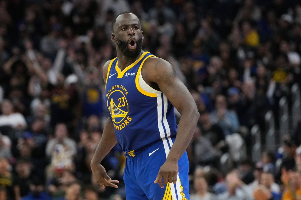 Draymond Green in his Golden State Warriors uniform with his mouth open.