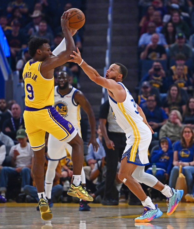 Golden State Warriors' Stephen Curry (30) guards Los Angeles Lakers' Bronny James Jr. (9) in the first quarter of their preseason NBA game at Chase Center in San Francisco, Calif., on Sunday, Oct. 5, 2025. (Jose Carlos Fajardo/Bay Area News Group)