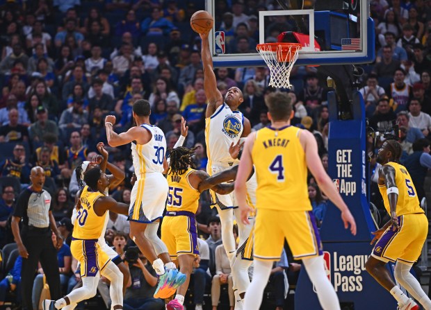 Golden State Warriors' Al Horford (20) blocks a shot by Los Angeles Lakers' R.J. Davis (55) in the second quarter of their preseason NBA game at Chase Center in San Francisco, Calif., on Sunday, Oct. 5, 2025. (Jose Carlos Fajardo/Bay Area News Group)