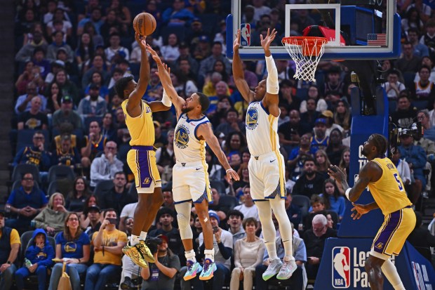 Golden State Warriors' Stephen Curry (30) and Al Horford (20) attempt to guard Los Angeles Lakers' Bronny James Jr. (9) in the second quarter of their preseason NBA game at Chase Center in San Francisco, Calif., on Sunday, Oct. 5, 2025. (Jose Carlos Fajardo/Bay Area News Group)