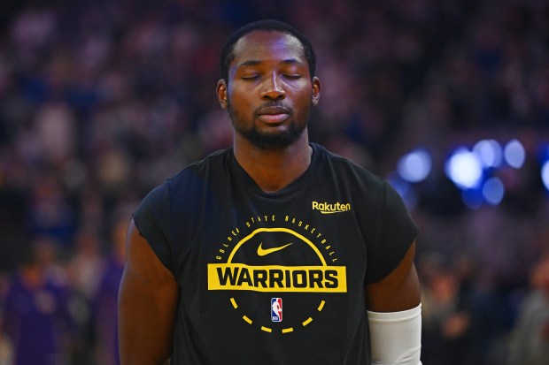 Golden State Warriors' Jonathan Kuminga (1) stands on the court during the national anthem before their preseason NBA game at Chase Center in San Francisco, Calif., on Sunday, Oct. 5, 2025. (Jose Carlos Fajardo/Bay Area News Group)