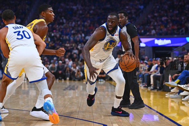 Golden State Warriors' Draymond Green (23) drives past Los Angeles Lakers' Rui Hachimura (28) in the first quarter of their preseason NBA game at Chase Center in San Francisco, Calif., on Sunday, Oct. 5, 2025. (Jose Carlos Fajardo/Bay Area News Group)