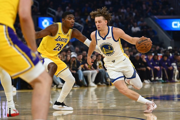 Golden State Warriors' Brandin Podziemski (2) drives past Los Angeles Lakers' Rui Hachimura (28) in the first quarter of their preseason NBA game at Chase Center in San Francisco, Calif., on Sunday, Oct. 5, 2025. (Jose Carlos Fajardo/Bay Area News Group)