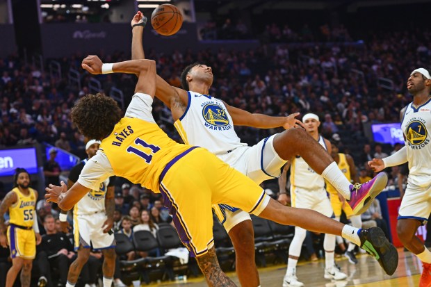 Golden State Warriors' Trayce Jackson-Davis (32) fouls Los Angeles Lakers' Jaxson Hayes (11) in the third quarter of their preseason NBA game at Chase Center in San Francisco, Calif., on Sunday, Oct. 5, 2025. (Jose Carlos Fajardo/Bay Area News Group)