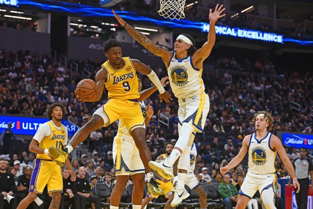 Los Angeles Lakers' Bronny James Jr. (9) drives to the basket past Golden State Warriors' Gui Santos (15) in the third quarter of their preseason NBA game at Chase Center in San Francisco, Calif., on Sunday, Oct. 5, 2025. (Jose Carlos Fajardo/Bay Area News Group)