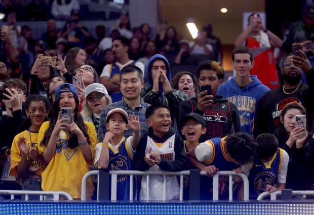 Golden State Warriors fans react as the team is introduced...