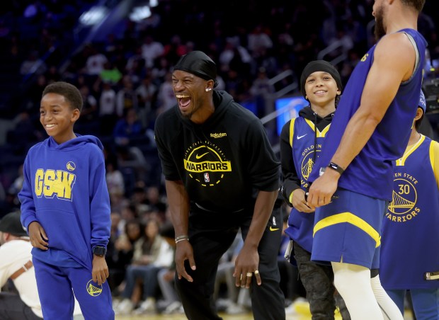 Golden State Warriors' Jonathan Kuminga #00 reacts as the team...
