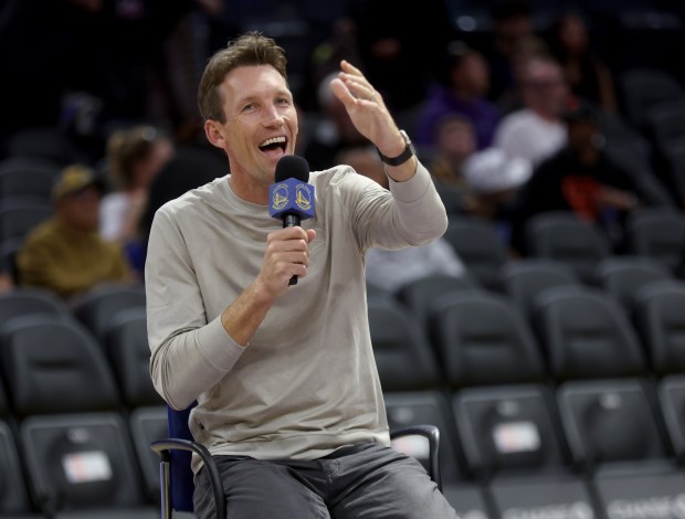 Golden State Warriors General Manager Mike Dunleavy speaks to fans...