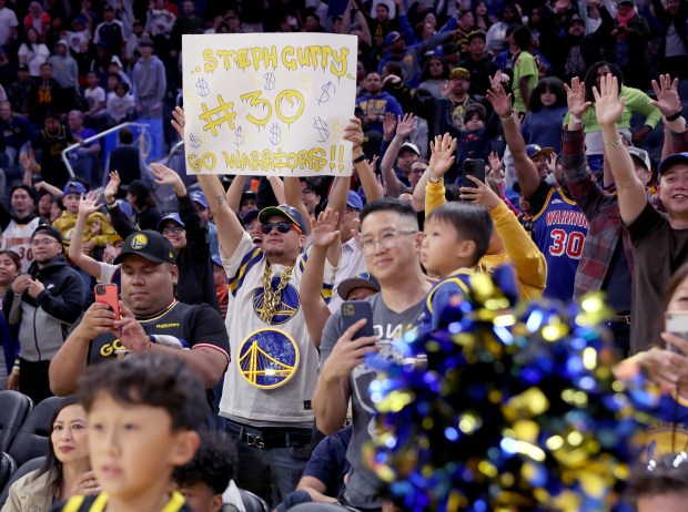 Golden State Warriors fans react during their open practice at...