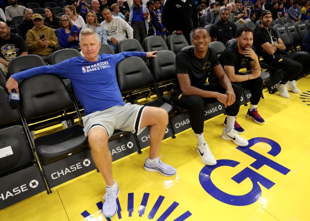 Golden State Warriors head coach Steve Kerr watches from the...