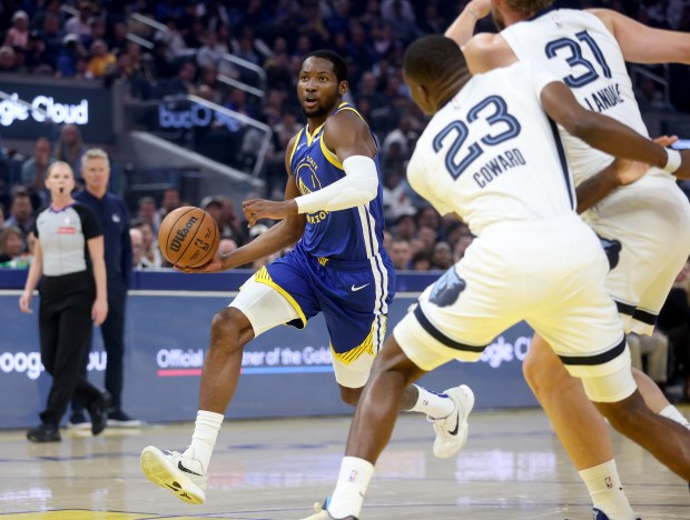 Golden State Warriors' Jonathan Kuminga #1 brings the ball down...