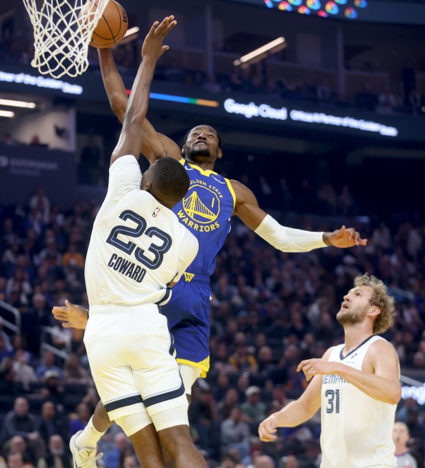 Golden State Warriors' Jonathan Kuminga #1 dunks past Memphis Grizzlies'...