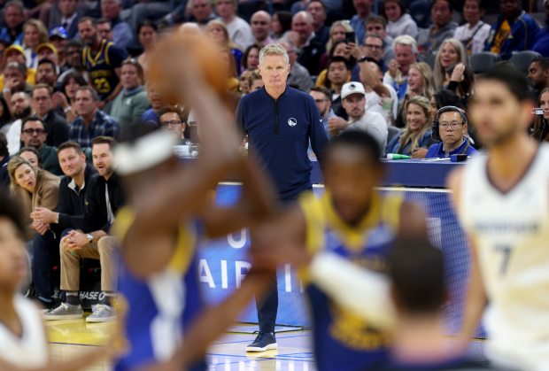 Golden State Warriors head coach Steve Kerr watches the action...