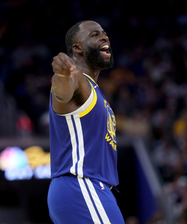 Golden State Warriors' Draymond Green #23 reacts after he was...