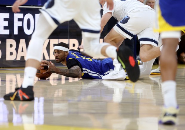 Golden State Warriors' Gary Payton II #0 grabs a loose...