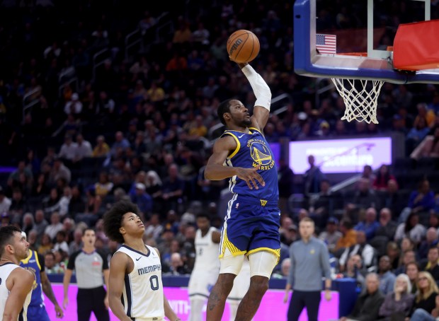 Golden State Warriors' Jonathan Kuminga #1 dunks past Memphis Grizzlies'...