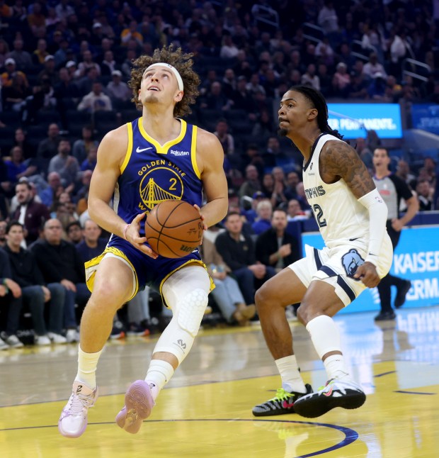 Golden State Warriors' Brandin Podziemski #2 looks to shoot as...