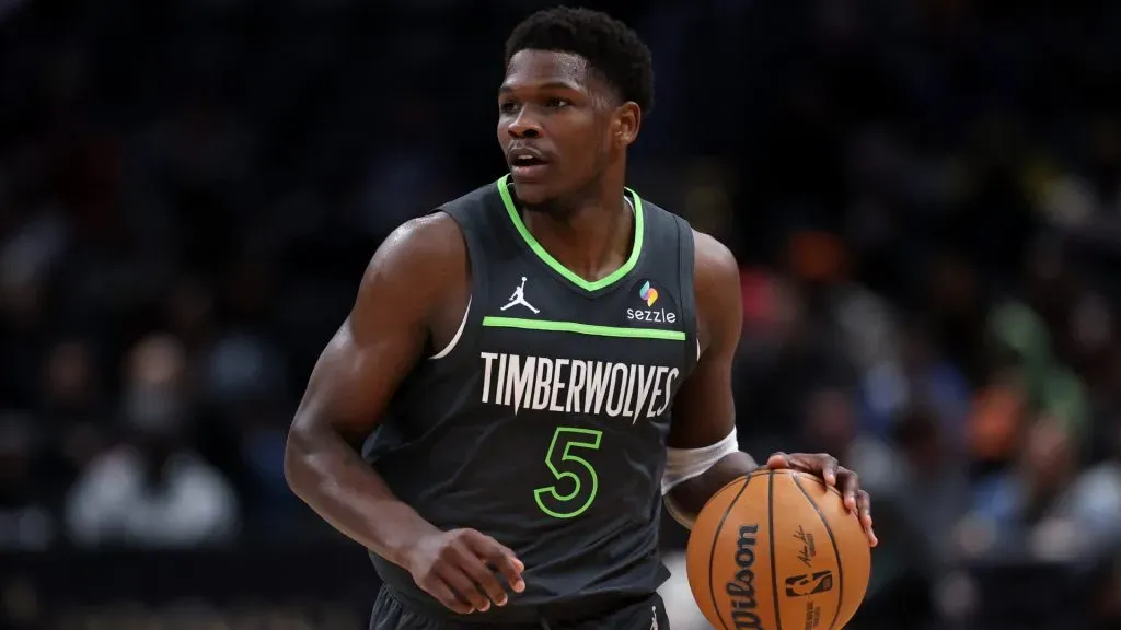 Anthony Edwards dribbles the ball. (Patrick Smith/Getty Images)