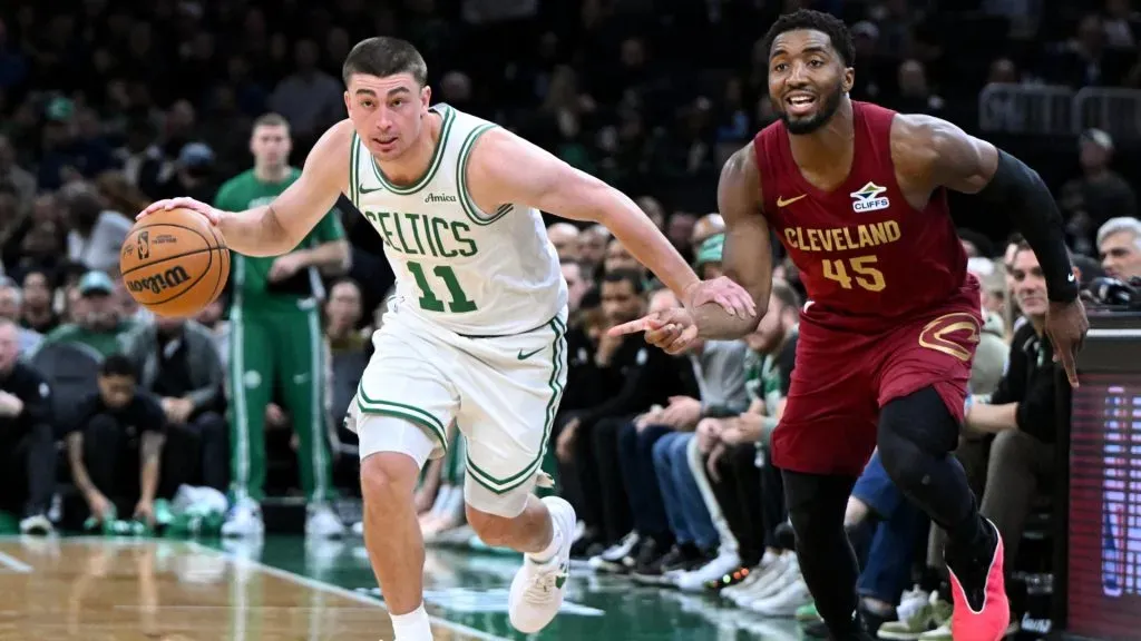 Payton Pritchard drives to the basket against Donovan Mitchell. (Getty Images)