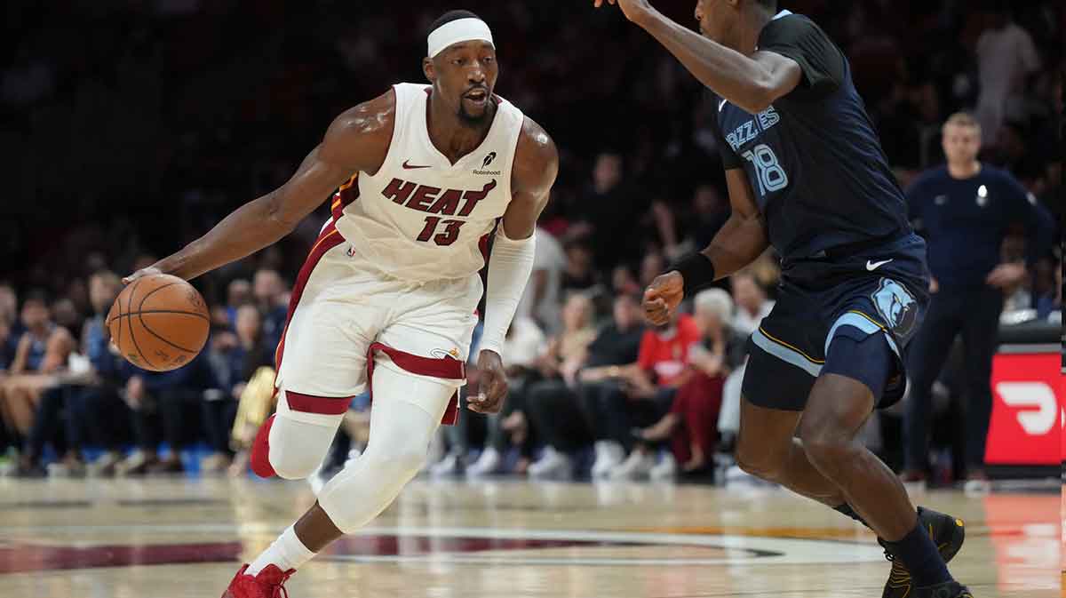 Miami Heat center Bam Adebayo (13) drives to the basket as Memphis Grizzlies forward Olivier-Maxence Prosper (18) defends during the first half at Kaseya Center