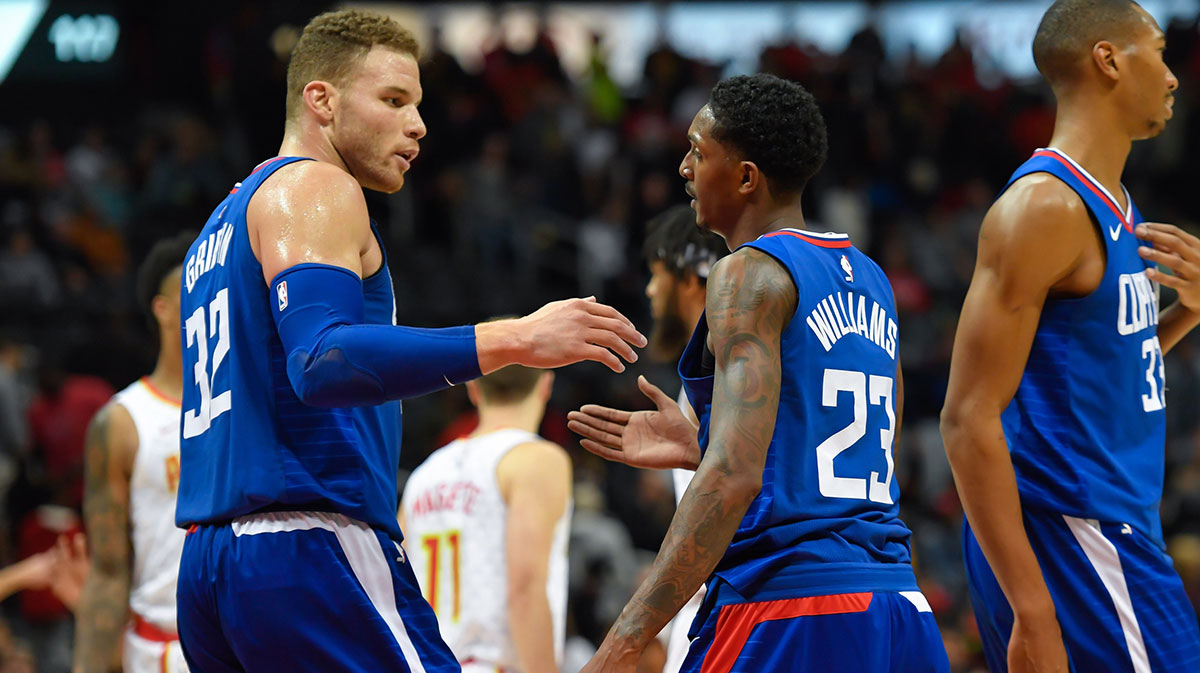 LA Clippers forward Blake Griffin (32) and guard Lou Williams (23) react after defeating the Atlanta Hawks at Philips Arena.