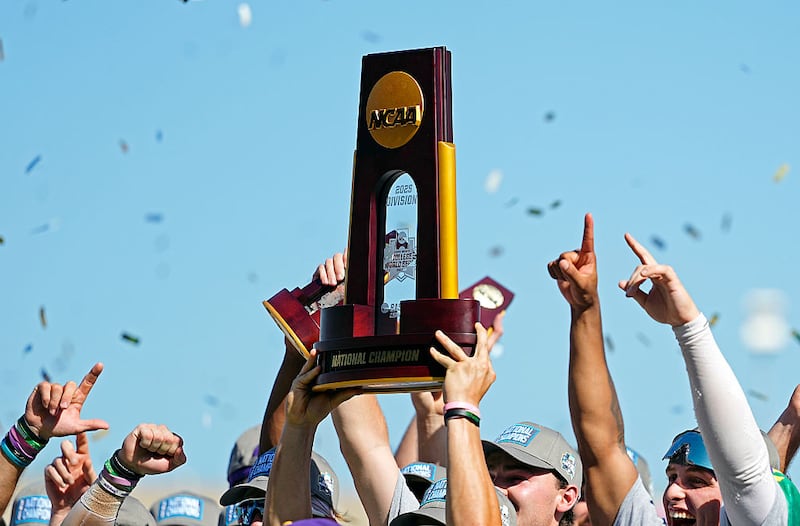 OMAHA, NEBRASKA - JUNE 22: The NCAA College World Series Championship trophy is hoisted after LSU Tigers defeated the Coastal Carolina Chanticleers at Charles Schwab Field on June 22, 2025 in Omaha, Nebraska. (Photo by Jay Biggerstaff/Getty Images)