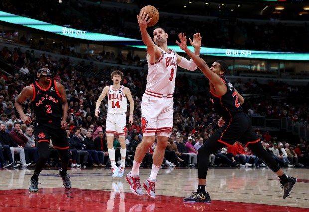 Bulls' Nikola Vučević catches a pass in the post in the second half of a game against the Raptors at the United Center on April 1, 2025. (Chris Sweda/Chicago Tribune)