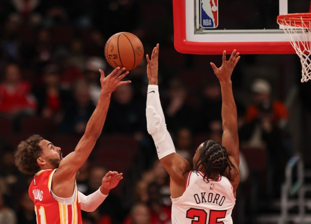 Atlanta Hawks guard Trae Young (11) goes up for a layup and misses against the Chicago Bulls' Isaac Okoro (35) in the first quarter, Monday, Oct. 27, 2025, at the United Center in Chicago. (Dominic Di Palermo/Chicago Tribune)