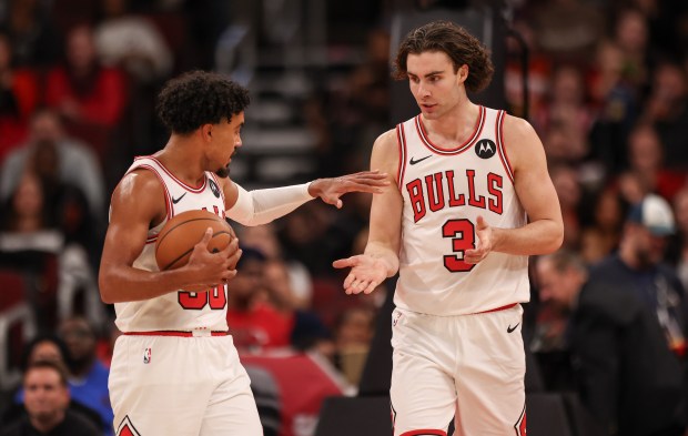Chicago Bulls guard Tre Jones (30) and Chicago Bulls guard Josh Giddey (3) high-five at the end of the first half during a game against the Atlanta Hawks, Monday, Oct. 27, 2025, at the United Center in Chicago. (Dominic Di Palermo/Chicago Tribune)