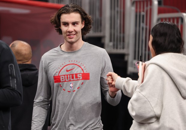 Chicago Bulls guard Josh Giddey (3) greets a fan wile heading to practice before a game against the Atlanta Hawks, Monday, Oct. 27, 2025, at the United Center in Chicago. (Dominic Di Palermo/Chicago Tribune)