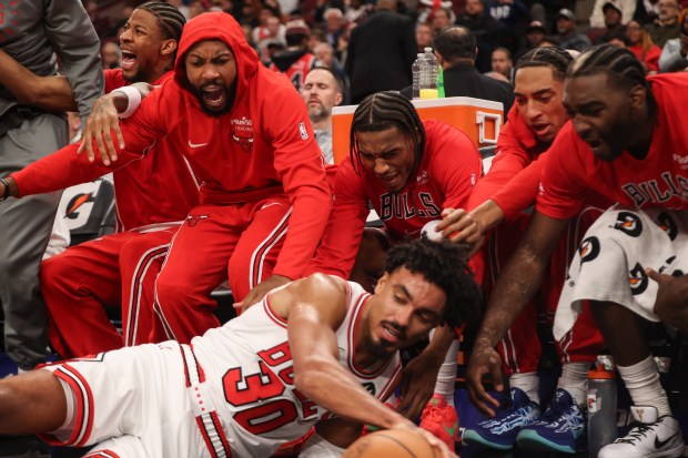 The Chicago Bulls bench reacts after Chicago Bulls guard Tre Jones (30) fell in front of them in the fourth quarter during a game against the Atlanta Hawks, Monday, Oct. 27, 2025, at the United Center in Chicago. (Dominic Di Palermo/Chicago Tribune)