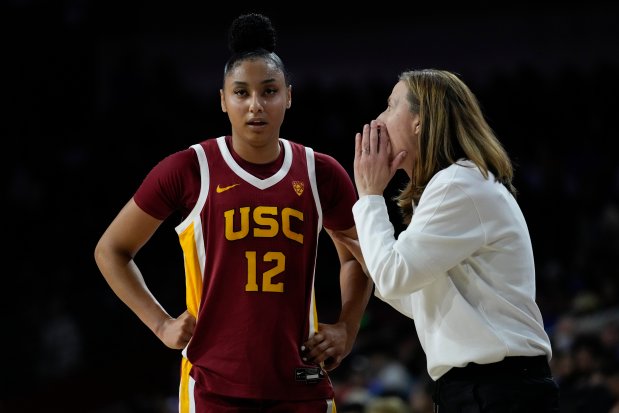 USC guard JuJu Watkins talks with coach Lindsay Gottlieb during a game against UCLA on Jan. 14, 2024, in Los Angeles. (AP Photo/Ashley Landis)