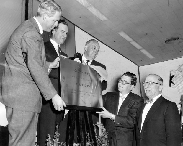 The 19th new building to be constructed since the Illinois Institute of Technology launched its expansion program in 1943 was dedicated on April 30, 1956. Named S. R. Crown Hall, it provides the most modern developments in design and facilities. At the ceremony were front, from left: Irving and John Crown, whose family contributed to the building. Back, from left: Jay Doblin, director of the Institute of design; Dr. John T. Rettaliata, president of the school, and Ludwig Mies van der Rohe, head of the architecture department and designer of the building. (Chicago Tribune historical photo)