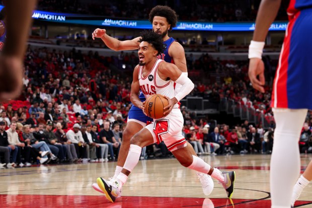 Chicago Bulls guard Tre Jones (30) drives against Detroit Pistons guard Cade Cunningham (2) during the first quarter of the home opener at the United Center Wednesday Oct. 22, 2025 in Chicago. (Armando L. Sanchez/Chicago Tribune)