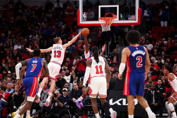 Chicago Bulls guard Kevin Huerter (13) blocks Detroit Pistons forward Ronald Holland II (5) from making a shot during the first quarter of the home opener at the United Center Wednesday Oct. 22, 2025 in Chicago. (Armando L. Sanchez/Chicago Tribune)