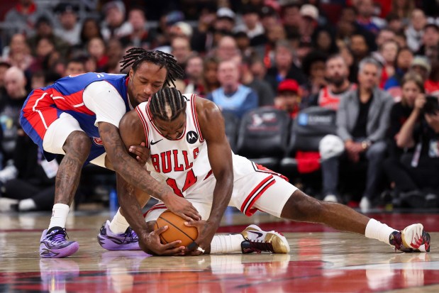 Detroit Pistons forward Ronald Holland II (5) and Chicago Bulls forward Patrick Williams (44) fight for possession of the ball during the second quarter of the home opener at the United Center Wednesday Oct. 22, 2025 in Chicago. (Armando L. Sanchez/Chicago Tribune)