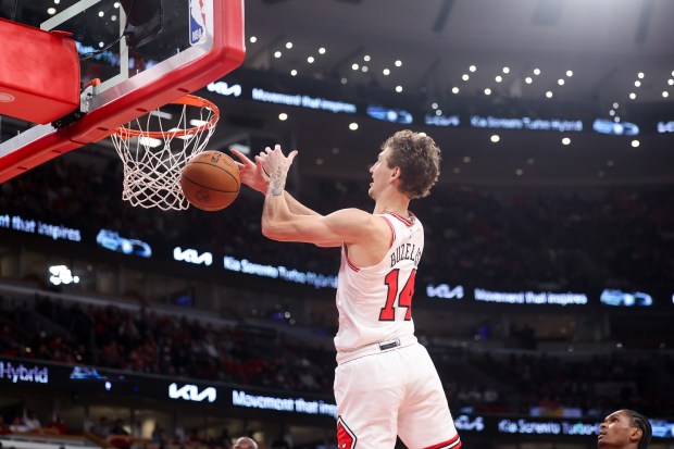 Chicago Bulls forward Matas Buzelis (14) misses pass for a dunk during the second quarter of the home opener against the Detroit Pistons at the United Center Wednesday Oct. 22, 2025 in Chicago. (Armando L. Sanchez/Chicago Tribune)