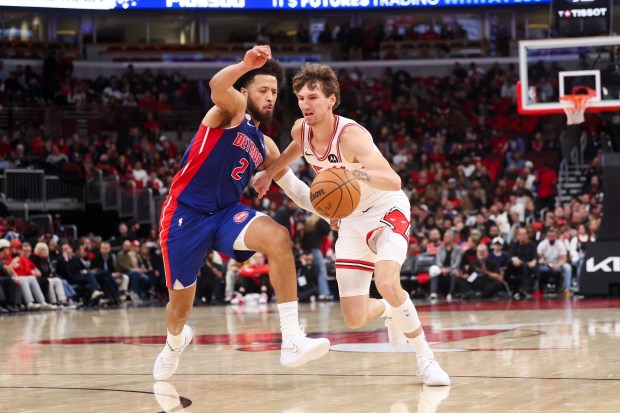 Detroit Pistons guard Cade Cunningham (2) guards Chicago Bulls forward Matas Buzelis (14) during the second quarter of the home opener at the United Center Wednesday Oct. 22, 2025 in Chicago. (Armando L. Sanchez/Chicago Tribune)