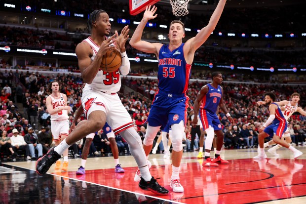 Chicago Bulls forward Isaac Okoro (35) calls a time out while falling out of bounds during the second quarter of the home opener against the Detroit Pistons at the United Center Wednesday Oct. 22, 2025 in Chicago. (Armando L. Sanchez/Chicago Tribune)