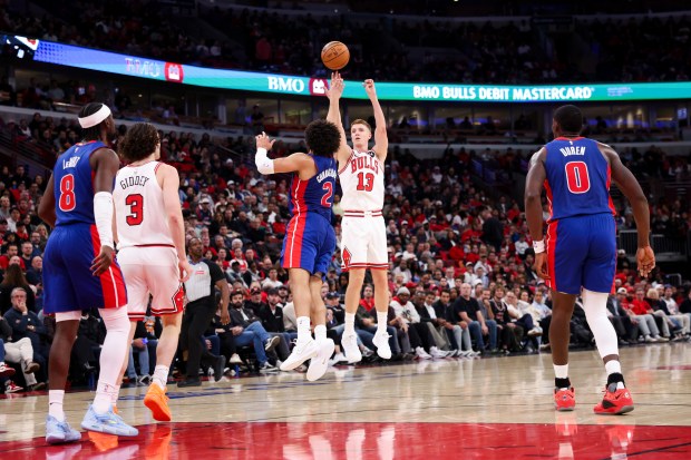 Chicago Bulls guard Kevin Huerter (13) shoots a three-point-basket during the second quarter of the home opener against the Detroit Pistons at the United Center Wednesday Oct. 22, 2025 in Chicago. (Armando L. Sanchez/Chicago Tribune)