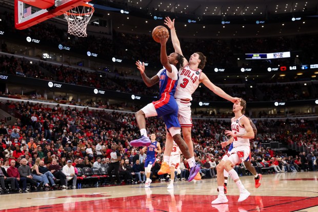 Chicago Bulls guard Josh Giddey (3) fouls Detroit Pistons forward Ronald Holland II (5) during the third quarter of the home opener at the United Center Wednesday Oct. 22, 2025 in Chicago. (Armando L. Sanchez/Chicago Tribune)