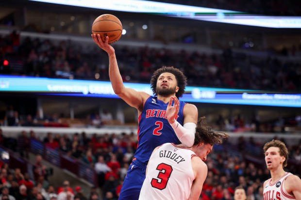 Chicago Bulls guard Josh Giddey (3) fouls Detroit Pistons guard Cade Cunningham (2) during the fourth quarter of the home opener at the United Center Wednesday Oct. 22, 2025 in Chicago. (Armando L. Sanchez/Chicago Tribune)