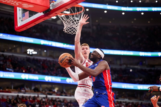 Chicago Bulls guard Kevin Huerter (13) guards Detroit Pistons guard Caris LeVert (8) while he goes up for a shot during the fourth quarter of the home opener at the United Center Wednesday Oct. 22, 2025 in Chicago. (Armando L. Sanchez/Chicago Tribune)