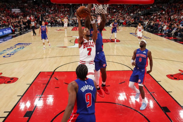 Chicago Bulls forward Dalen Terry (7) goes up for a shot against Detroit Pistons center Jalen Duren (0) during the second half of the home opener at the United Center Wednesday Oct. 22, 2025 in Chicago. (Armando L. Sanchez/Chicago Tribune)
